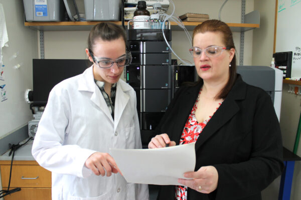 Jennifer Golden in her lab with a graduate student