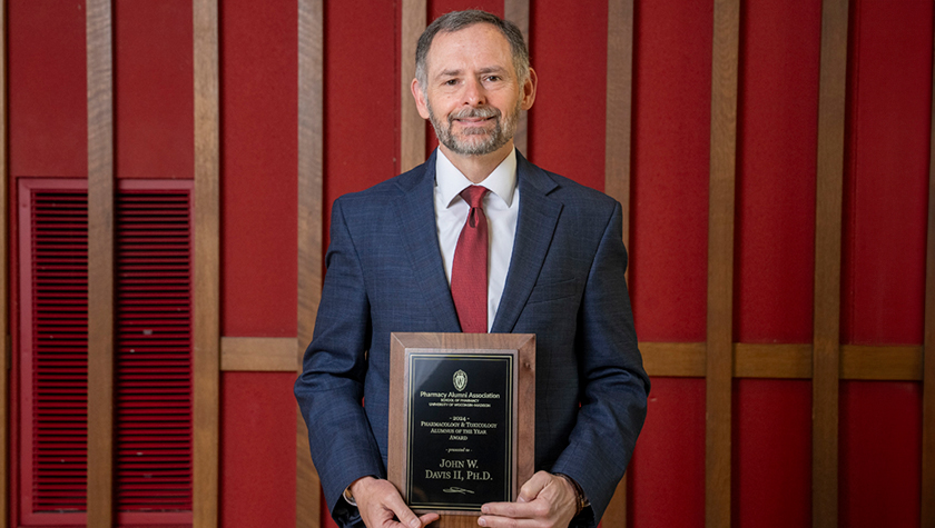 John Davis with his PharmTox Alum of the Year award