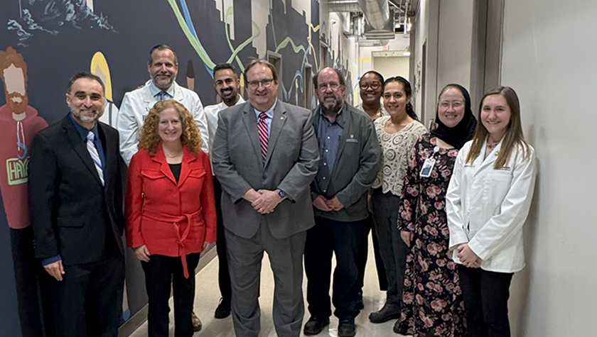 Group photo including Chancellor Mnookin, Associate Professor Jay Ford, and Dean Steve Swanson