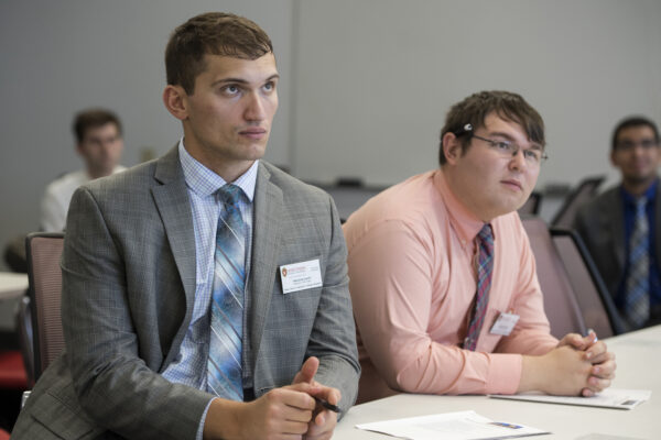 PharmD-MBA students Herolind Jusufi and Michael Heltne (L to R) listens to guest speakers and professors, during the new PharmD-MBA students orientation on Tuesday, September 4, 2018, in the Learning Commons.