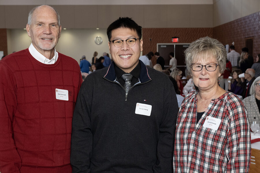 PharmD scholarship recipient, Daniel Xiong, center, poses with his Donors, Dale Schmidt (BS '82), and his wife, Kim Schmidt, right, during the Student Scholarship Brunch on Sunday, November 16, 2025, at Gordon Dining and Event Center. (Paul L. Newby II, Freelance Photographer)