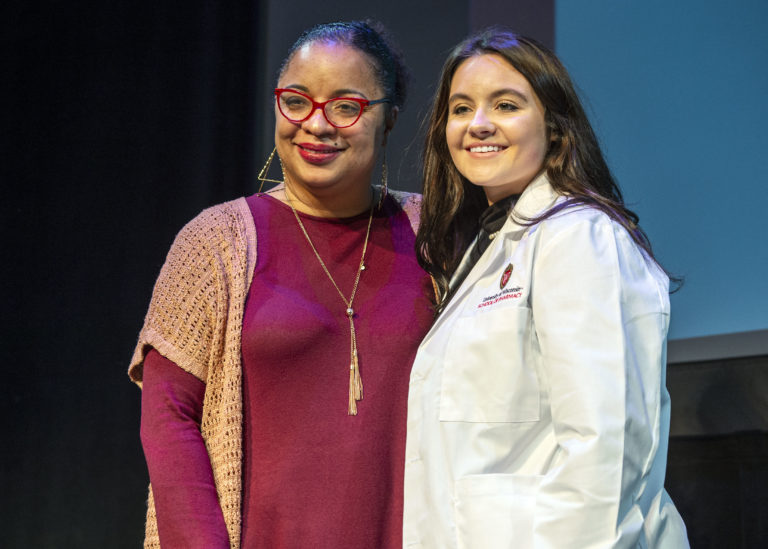 Yolanda Tolson and a student at the white coat ceremony