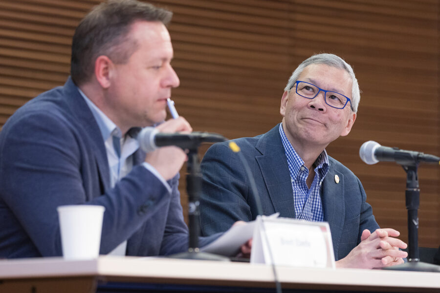 Brent Eberle and Roger Tung sit on a panel discussion