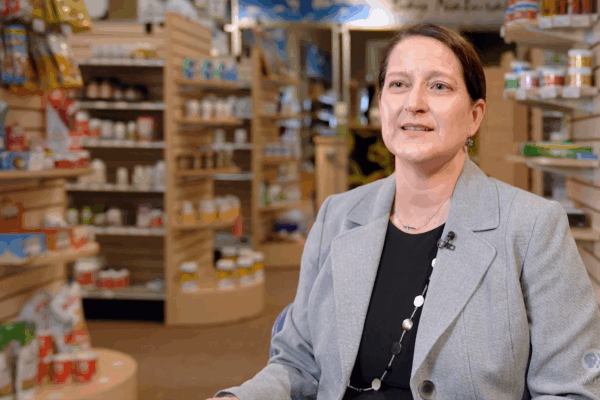 Nicole Schreiner speaks in a pharmacy