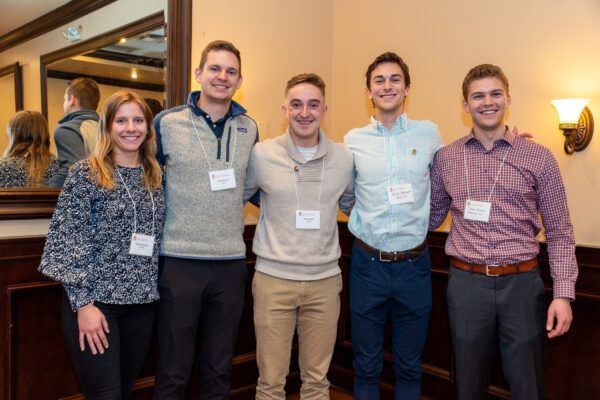 A group of alumni smile together during the Milwaukee innovators alumni event