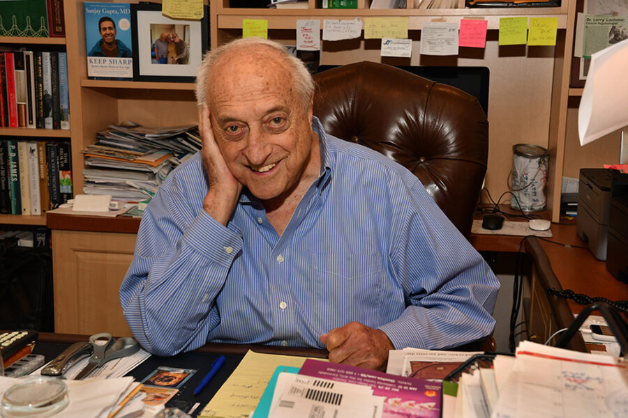 Leon Lachman at his desk