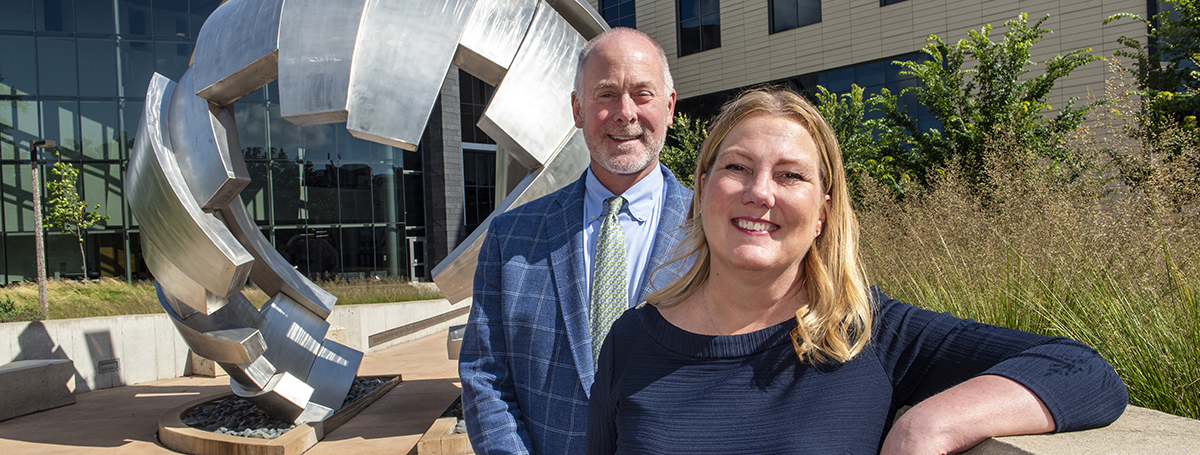 Lee Vermeulen and Jill Kolesar pose outside