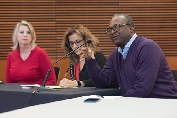 Debra Fluno, Azita Saleki-Gerhardt, and Bruce Scott share comments at a table