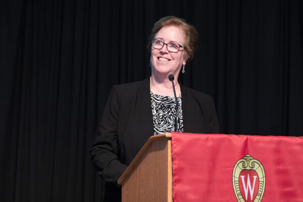 Janet Fritsch speaking at a podium