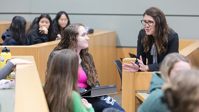 Lisa Imhoff speaking with a group of PharmD students during a DEI lecture