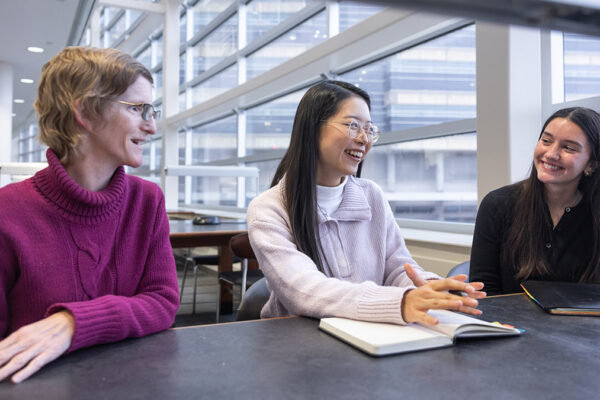 Kristi Jones, Jessica Liu, and Kira Kirsch speak at a table