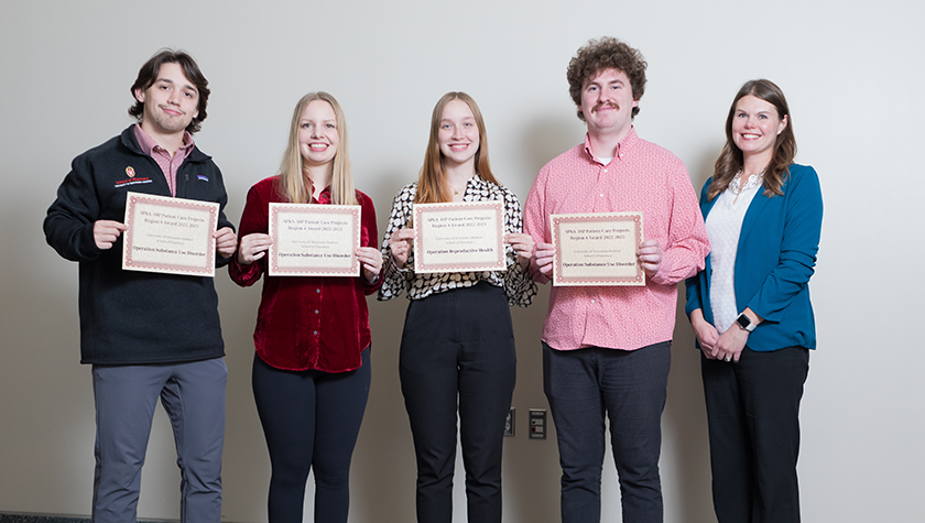 Lukas Kelsey, Jenna Nordin, Kelby Drogemueller, and Sawyer Fleming with Associate Professor Andrea Porter